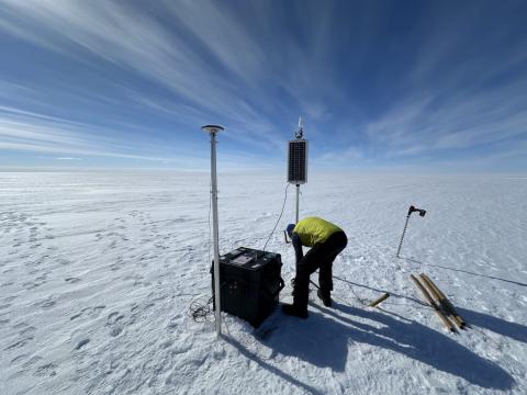 Mountain guide Daniel Mercier installs a new global navigation system station on the King Baudouin Ice Shelf in Antarctica